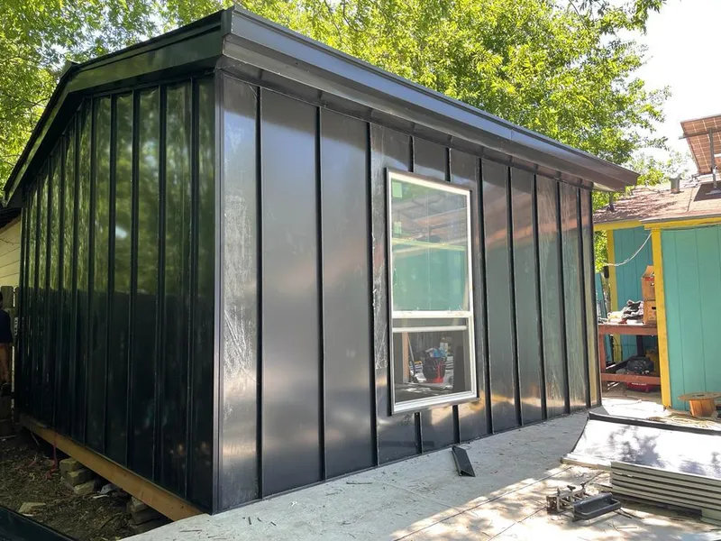 Black standing seam metal wall panels for Metal Roof Installation in Plainville